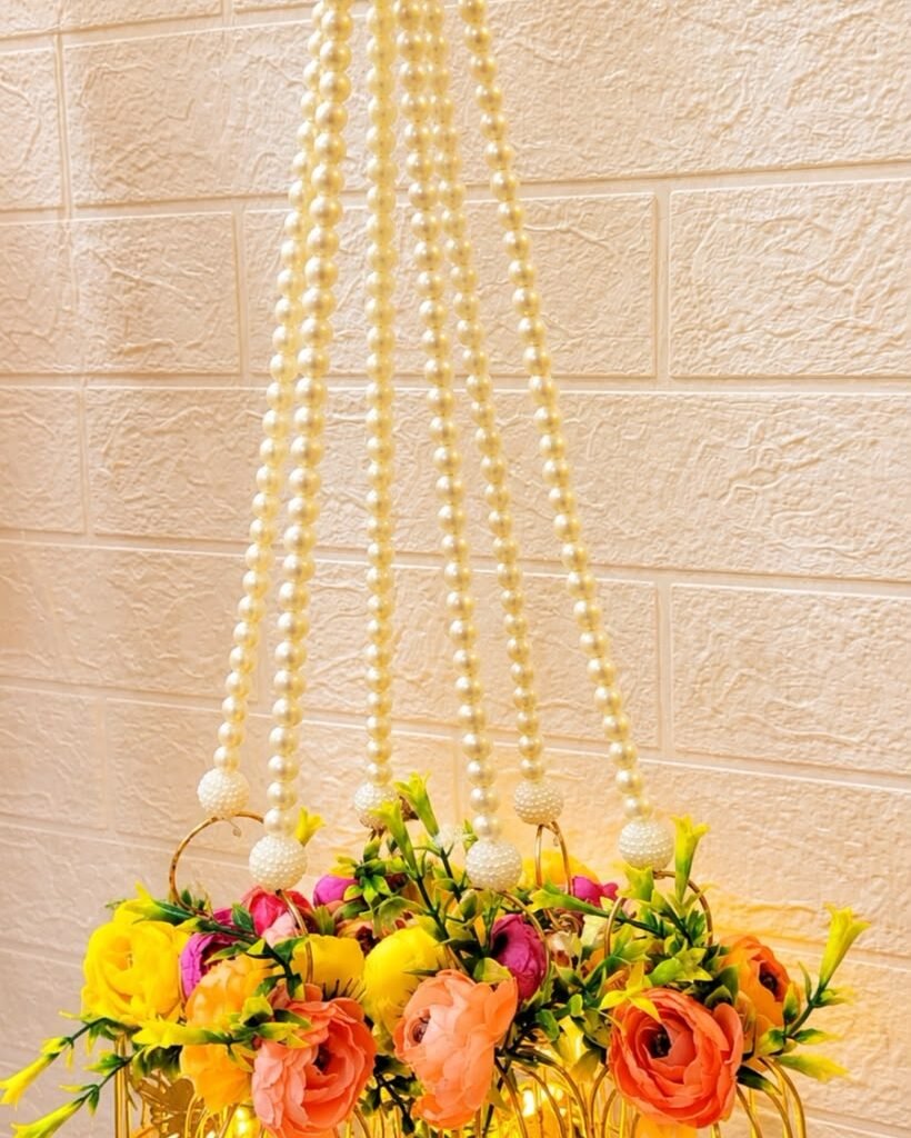 Peony cage hangings glowing with LED tealights. – Kachi Rasoi