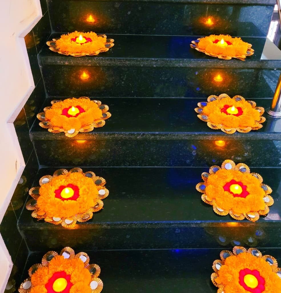 Marigold floral mats lighting up a staircase. – Kachi Rasoi